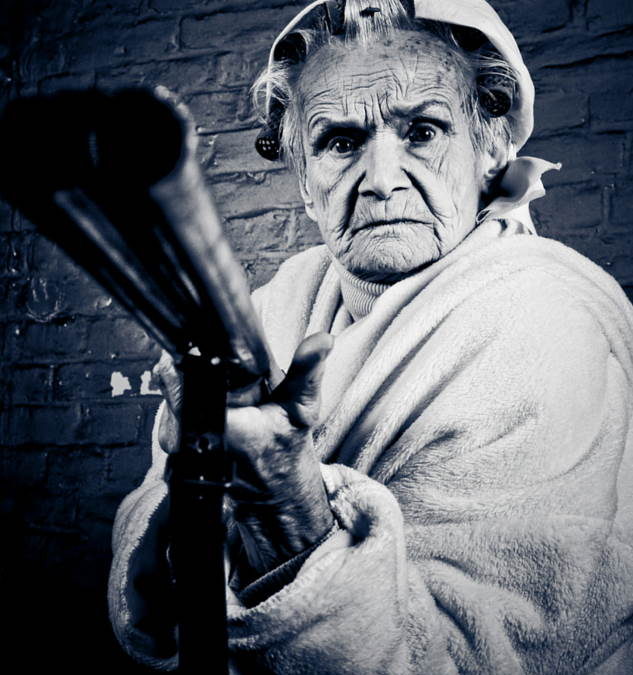 Really protect. Old woman with Gun.